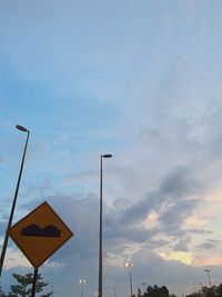 Low angle view of street light against sky