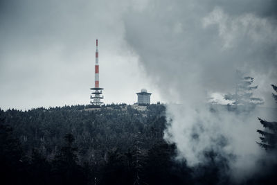 Smoke stacks against sky