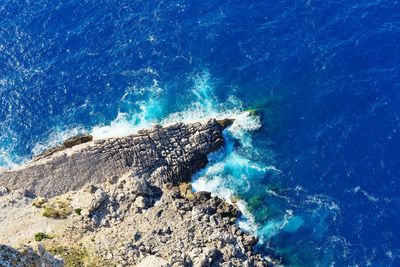 High angle view of rock in sea