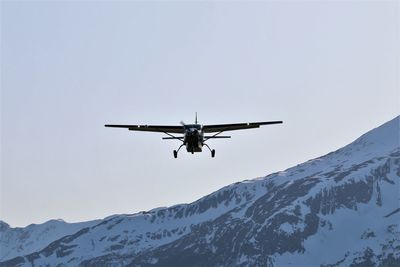 Low angle view of airplane flying in sky