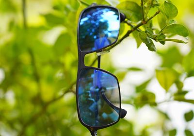 Close-up of sunglasses on glass