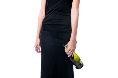 Midsection of woman standing on white background