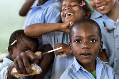 Portrait of boy with friends outdoors