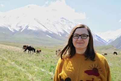 Portrait of woman with mountains in background