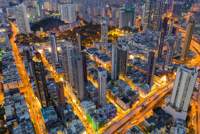 High angle view of city street and buildings at dusk