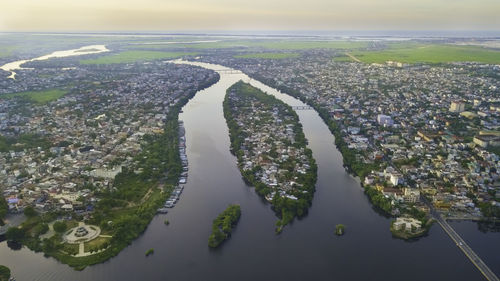 High angle view of river amidst buildings in city