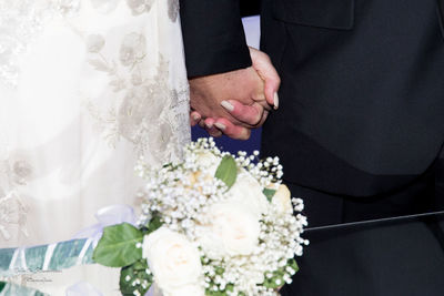 High angle view of flower bouquet against white wall