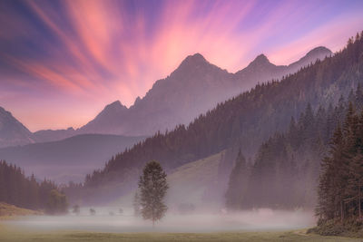 Scenic view of mountains against sky during sunset