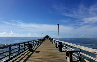 Jetty leading to calm sea