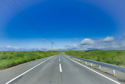 Empty road against sky