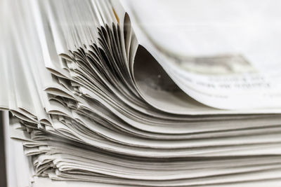 Close-up of stacked newspapers