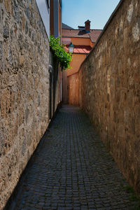 Narrow alley amidst buildings in city