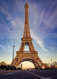 Low angle view of tower against cloudy sky