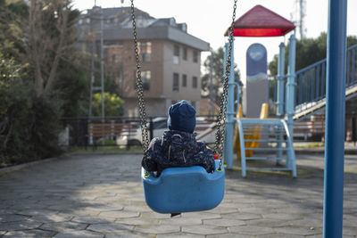 Empty chairs on footpath