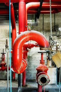 Close-up of red water pipe in factory