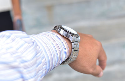 Close-up of hand against blurred background