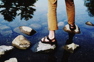 Low section of person standing on rock