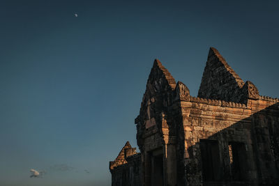 Low angle view of temple building against clear sky