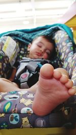 High angle view of boy relaxing stroller