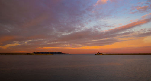 Scenic view of sea against sky during sunset