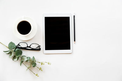 Directly above shot of coffee cup against white background