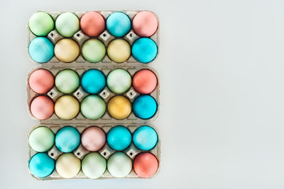 Directly above shot of eggs against white background