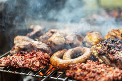 Close-up of meat on barbecue grill