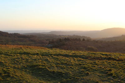 Scenic view of landscape against sky during sunset