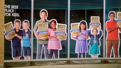 Portrait of happy friends standing in store