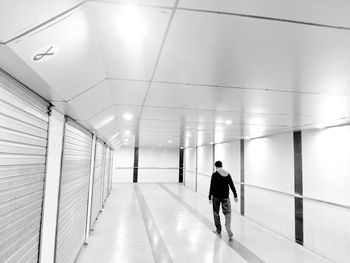 Man in illuminated corridor