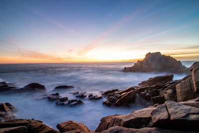 Scenic view of sea against sky during sunset