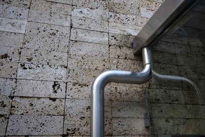 High angle view of metallic structure on footpath