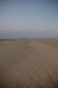 Scenic view of beach against clear sky