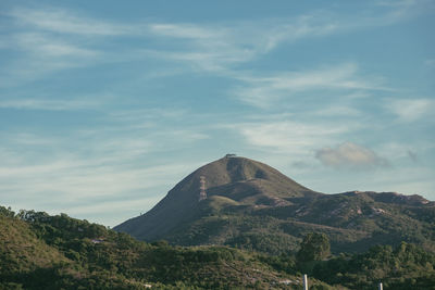 View of mountain range against cloudy sky