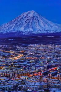 Aerial view of snowcapped mountain against sky