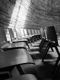 Light falling on empty chairs in building