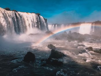 Scenic view of waterfall in sea