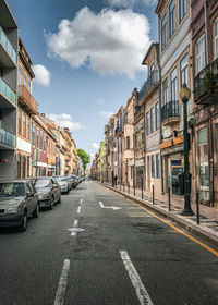 Street amidst buildings against sky