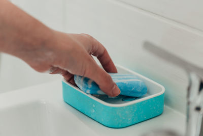 Cropped hand of man washing hands