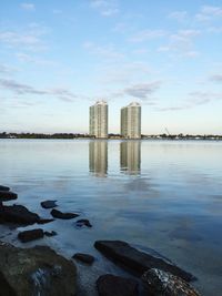 Reflection of buildings in sea