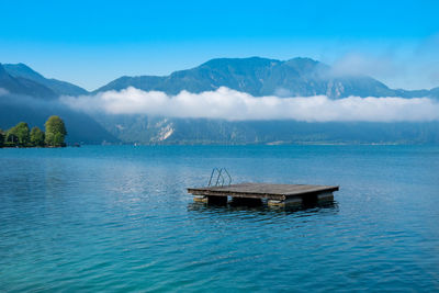 Boat on sea against blue sky