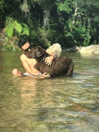 Full length of shirtless man in water