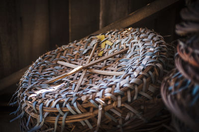 Close-up of wicker baskets for sale at street market during night