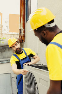 Side view of man working at construction site