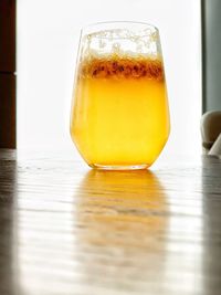 Close-up of beer glass on table