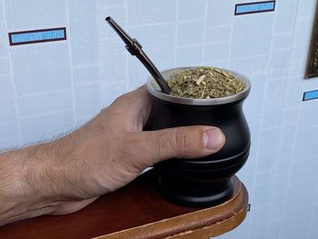 Midsection of man holding ice cream in bowl