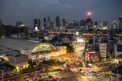 High angle view of illuminated buildings in city at night