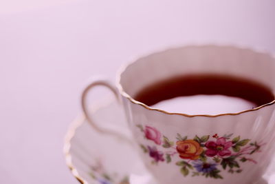 Close-up of tea on pink background