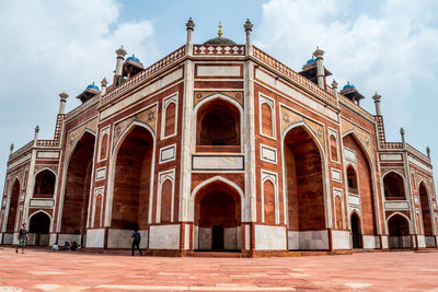 Facade of historic building against sky