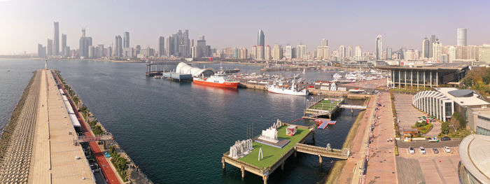 High angle view of harbor and buildings in city